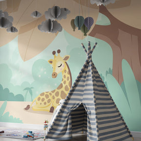 Nature-themed giraffe mural wallpaper in kids playroom with wooden toys and green accents