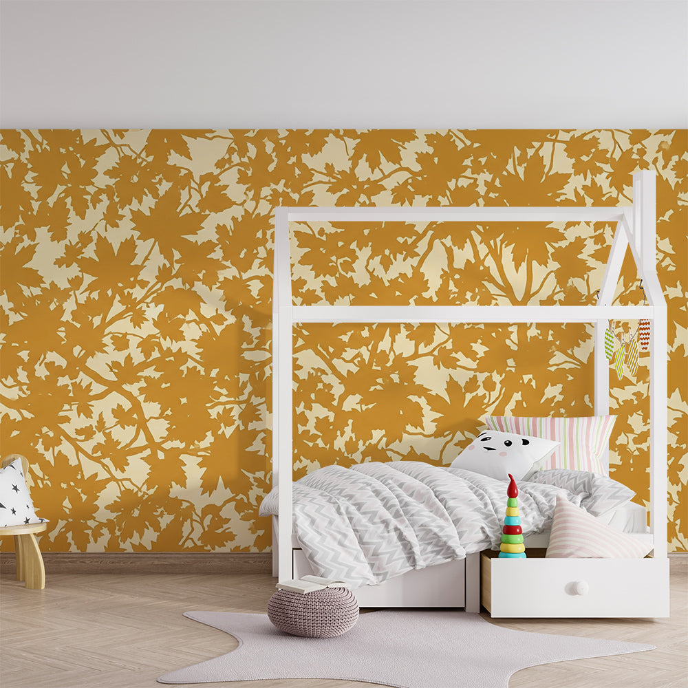 Kids-Mundo golden maple leaf wallpaper mural framing a cosy children's playroom nook