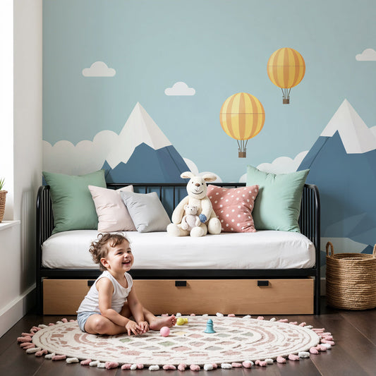 Kids-Mundo hot air balloon mountain wall mural in a calm nursery with a cot and soft neutral decor