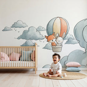 Hot air balloon mural wallpaper with fox and rabbit in cozy nursery setting by Kids-Mundo