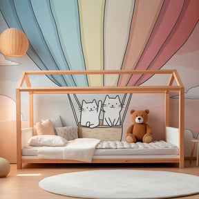 Pastel hot air balloon mural wallpaper with cats transforming kids playroom into magical space