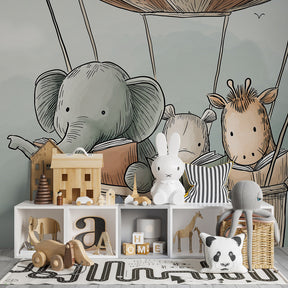 Children's bedroom with hot air balloon wallpaper creating magical reading corner atmosphere