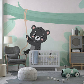 Kids jungle themed mural wallpaper with adorable jaguar character for playroom