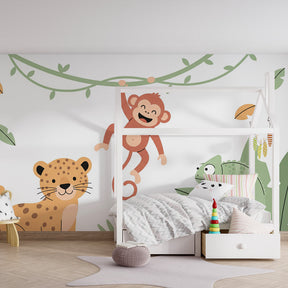 Children's jungle wallpaper with chameleon and tropical foliage in colorful playroom setting