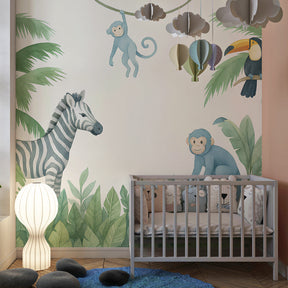 Blue green jungle wallpaper with tropical animals decorating children's playroom space