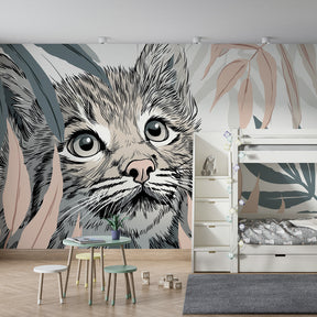 Tropical kitten wallpaper creating safari-themed children's bedroom with natural wood furniture