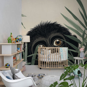 Safari themed nursery featuring adorable gorilla wallpaper with green foliage design