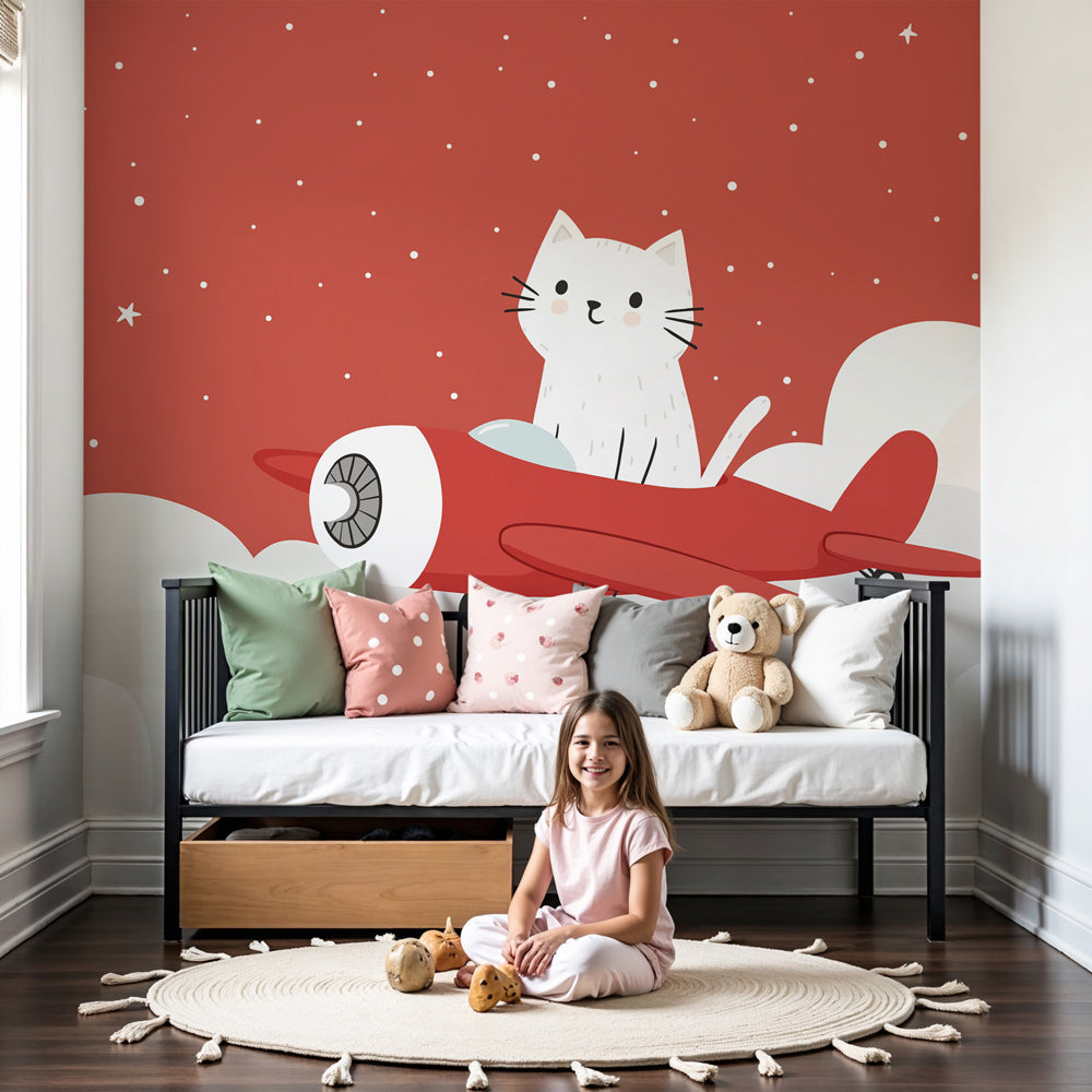 Kitten pilot mural wallpaper creating whimsical nursery decor with red airplane and clouds by Kids-Mundo
