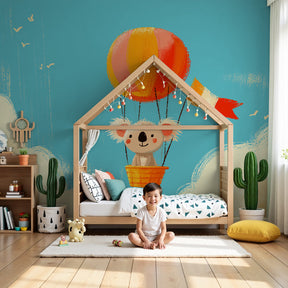 Koala hot air balloon mural wallpaper in modern nursery with white crib by Kids-Mundo