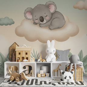 Dreamy koala mural wallpaper with tropical leaves accent wall in peaceful toddler room