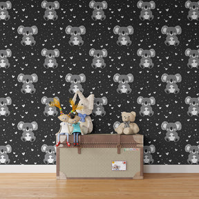 Children's bedroom featuring koala animal wallpaper with heart motifs and playful Australian theme