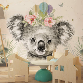 Koala and floral wallpaper creating peaceful baby room decor with soft beige tones
