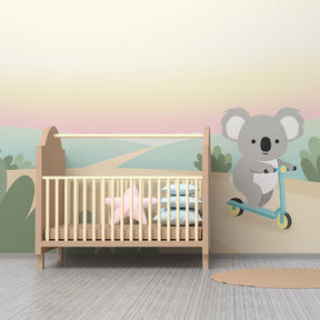 Desert koala adventure mural wallpaper creating calm nursery atmosphere with pastel tones