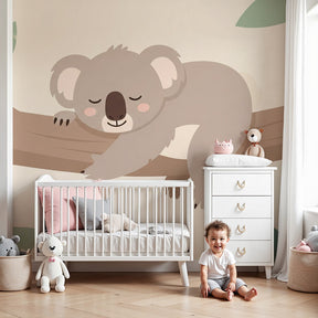 Sleeping koala mural wallpaper in peaceful nursery with natural wood furniture by Kids-Mundo
