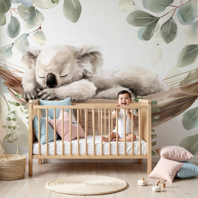 Koala mural wallpaper with sleeping baby in eucalyptus hammock decorating modern nursery by Kids-Mundo