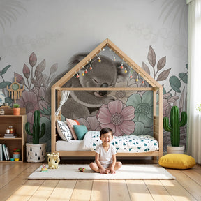 Koala mural wallpaper with sleeping animal among pastel flowers in modern nursery by Kids-Mundo
