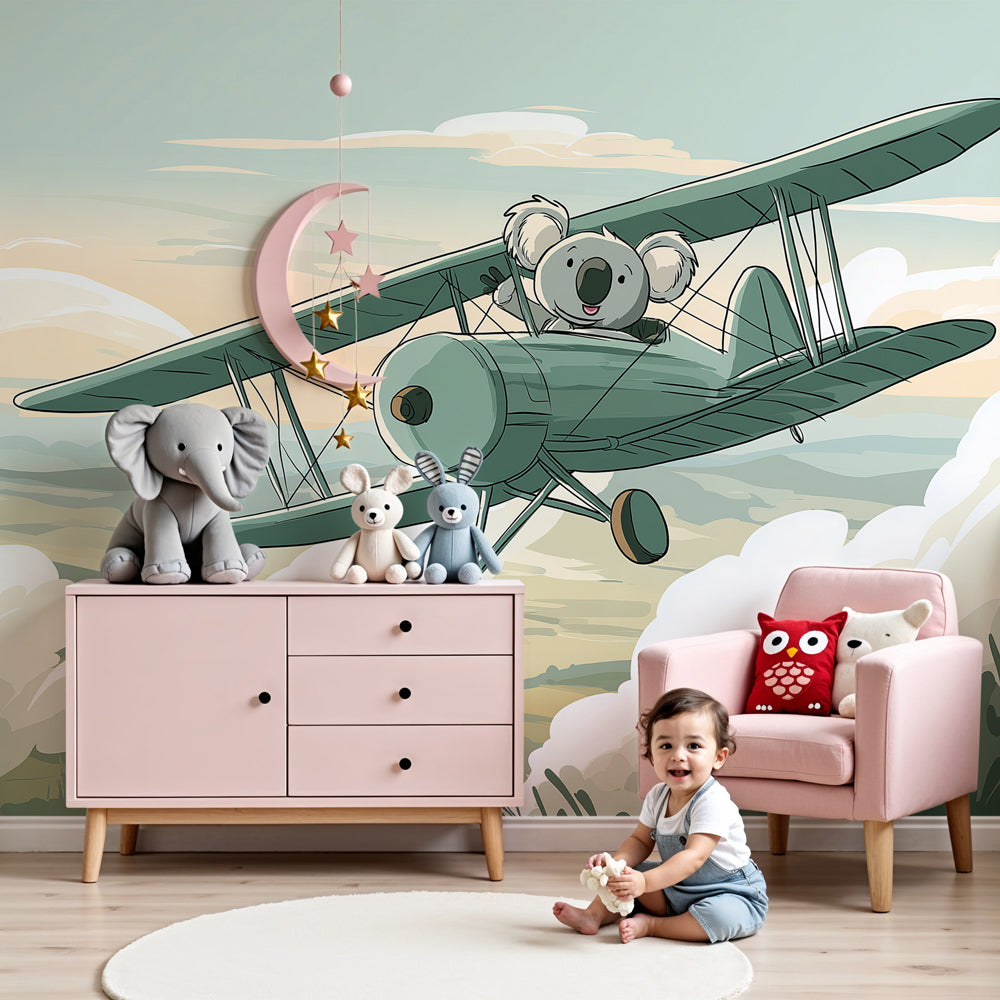 Koala pilot mural wallpaper in modern nursery with white crib and wooden furniture by Kids-Mundo