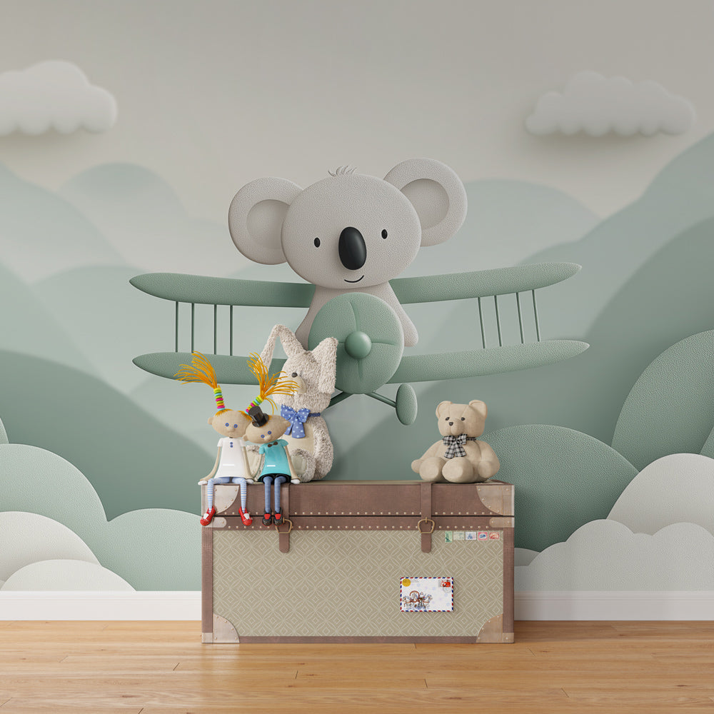 Adventure themed koala mural wallpaper transforming kids playroom with soft pastel colors