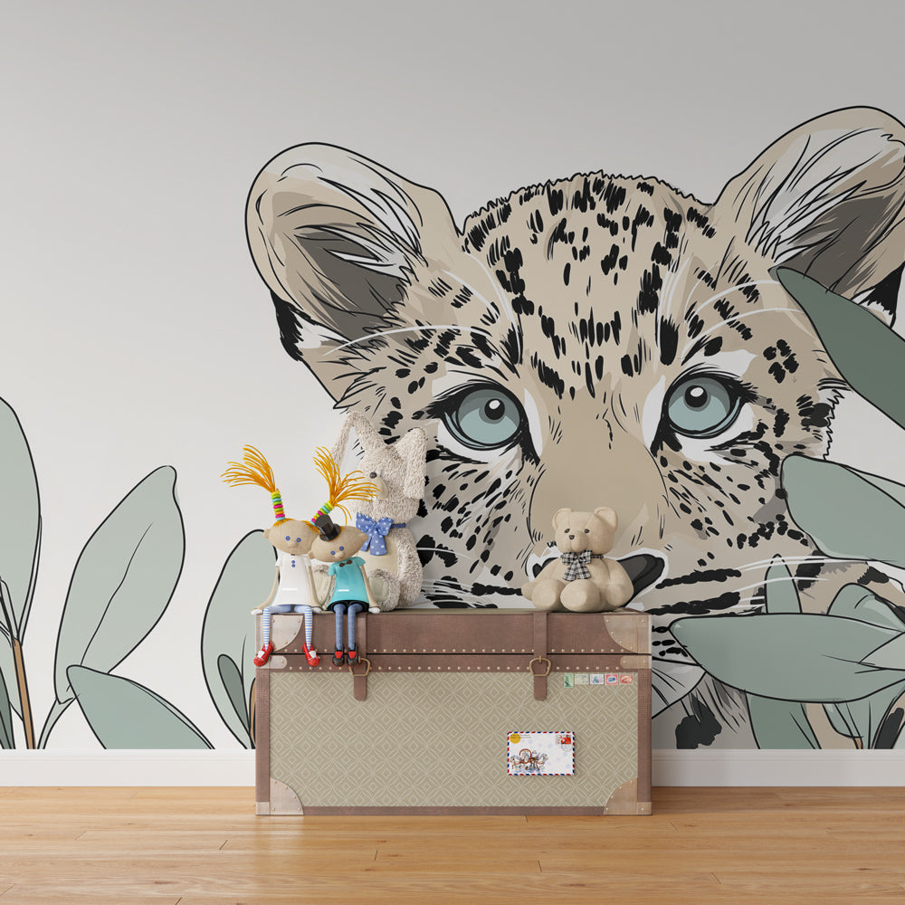 Children's bedroom featuring leopard mural wallpaper with foliage creating wild safari atmosphere