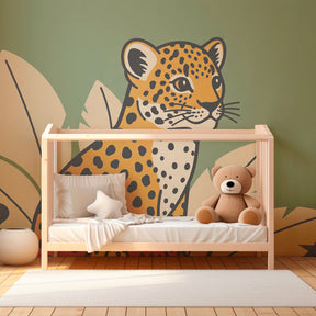 Safari leopard wallpaper creating jungle adventure theme in kids bedroom with green foliage