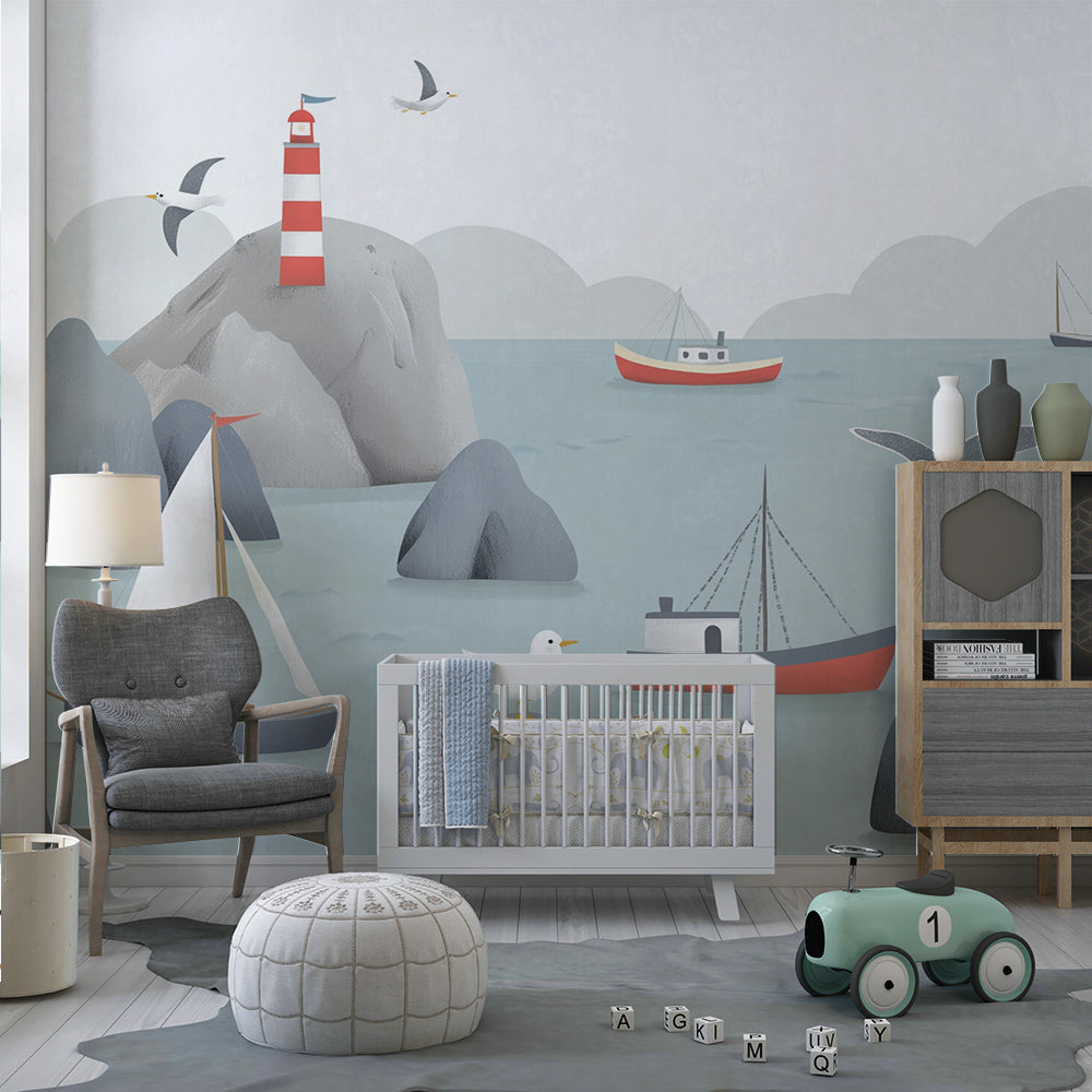 Kids-Mundo coastal lighthouse wall mural with sailboats shown in a bright playroom