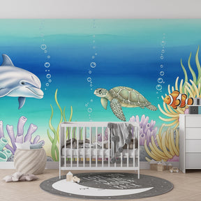 Sea life mural wallpaper featuring coral reef design in colorful kids playroom setting