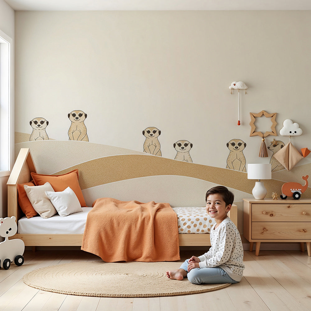 Kids-Mundo meerkats peeking over sand dunes wall mural styled behind a cot in a calm nursery