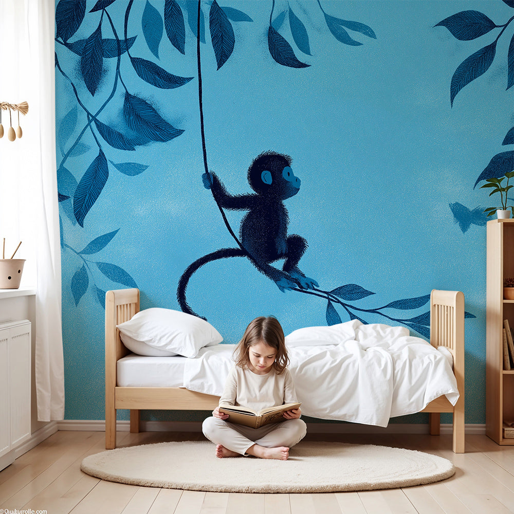 Kids-Mundo blue jungle monkey mural styled on a nursery wall behind a white cot and soft rug.
