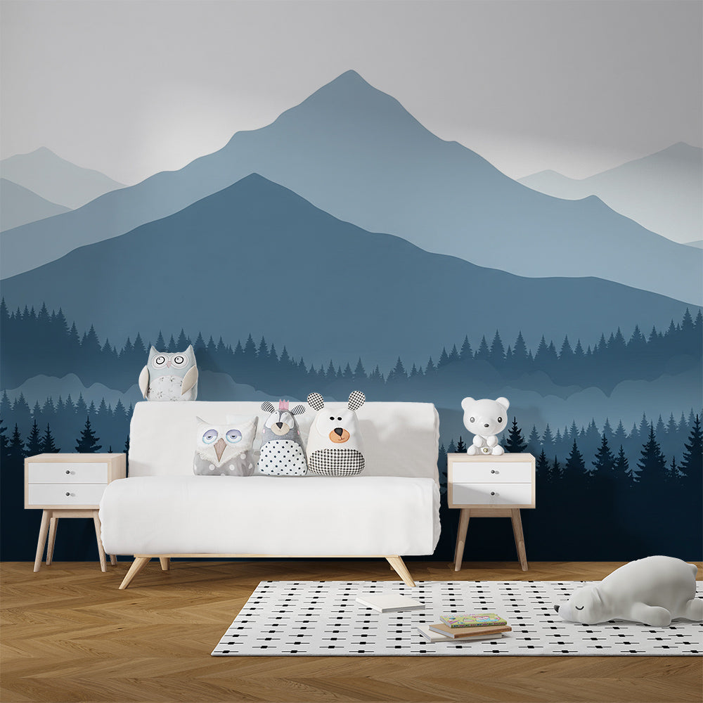 Kids-Mundo layered mountain forest mural on a playroom wall behind toy shelves and a reading corner