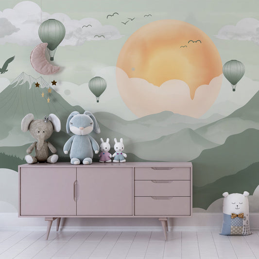 Kids-Mundo mountain wall mural with hot air balloons behind a bed in a calm kids bedroom setting
