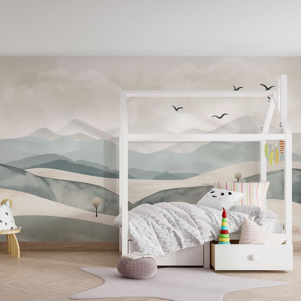 Kids-Mundo mountain wall mural bringing a calm backdrop to a bright, toy-filled playroom.