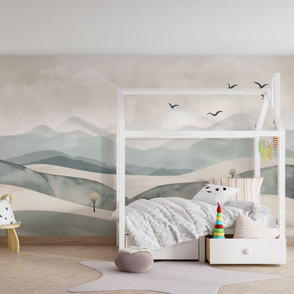 Kids-Mundo mountain wall mural bringing a calm backdrop to a bright, toy-filled playroom.