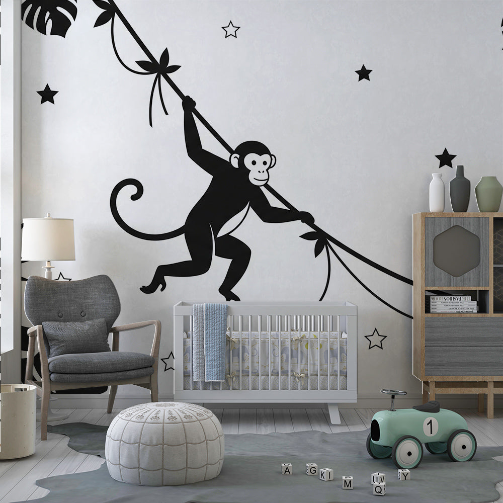 Kids-Mundo graphic black and white monkey and star wall mural in a child's playroom setting.