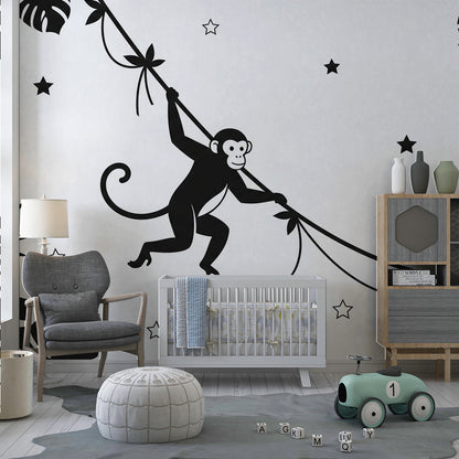 Kids-Mundo graphic black and white monkey and star wall mural in a child's playroom setting.