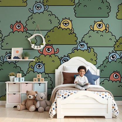 Nursery wall featuring a Kids-Mundo monster wall mural with characters peeking from leafy green bushes.