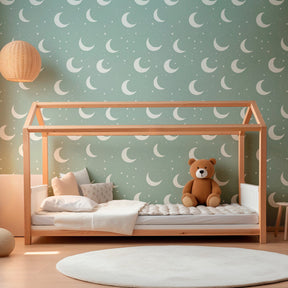 Celestial moon and star wallpaper creating dreamy atmosphere in children's bedroom interior