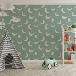 Blue celestial wallpaper with golden moons and stars creating magical kids bedroom atmosphere