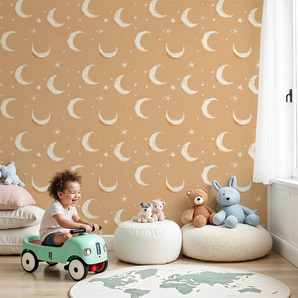 Moon and stars mural wallpaper creating celestial nursery decor with warm orange tones by Kids-Mundo