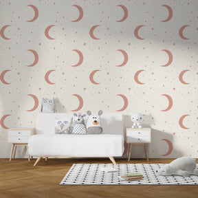 Celestial mural wallpaper with crescent moons and stars in soft pastels for kids room by Kids-Mundo