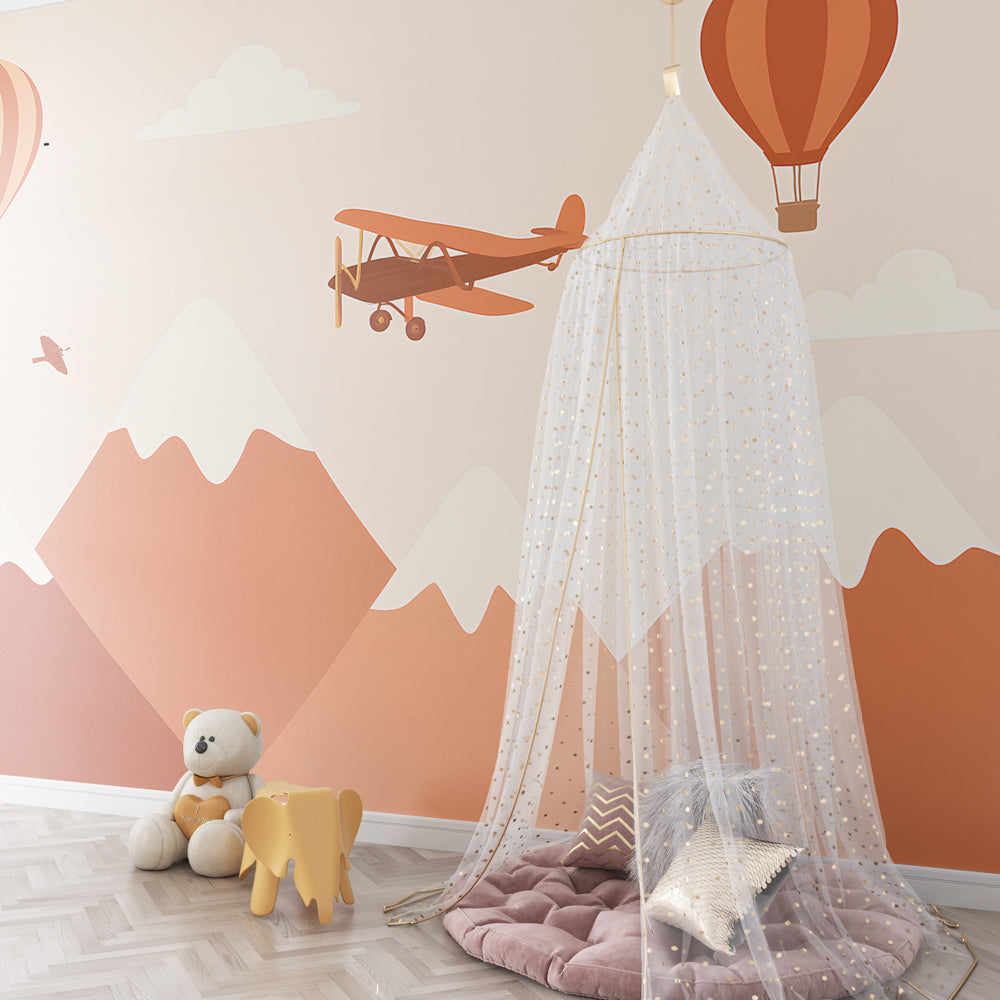 Toddler room decorated with mountain adventure mural wallpaper creating inspiring play space