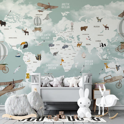 Kids-Mundo animal world map mural on a kids' bedroom wall, orcas and dolphins swimming beneath snowy mountains.