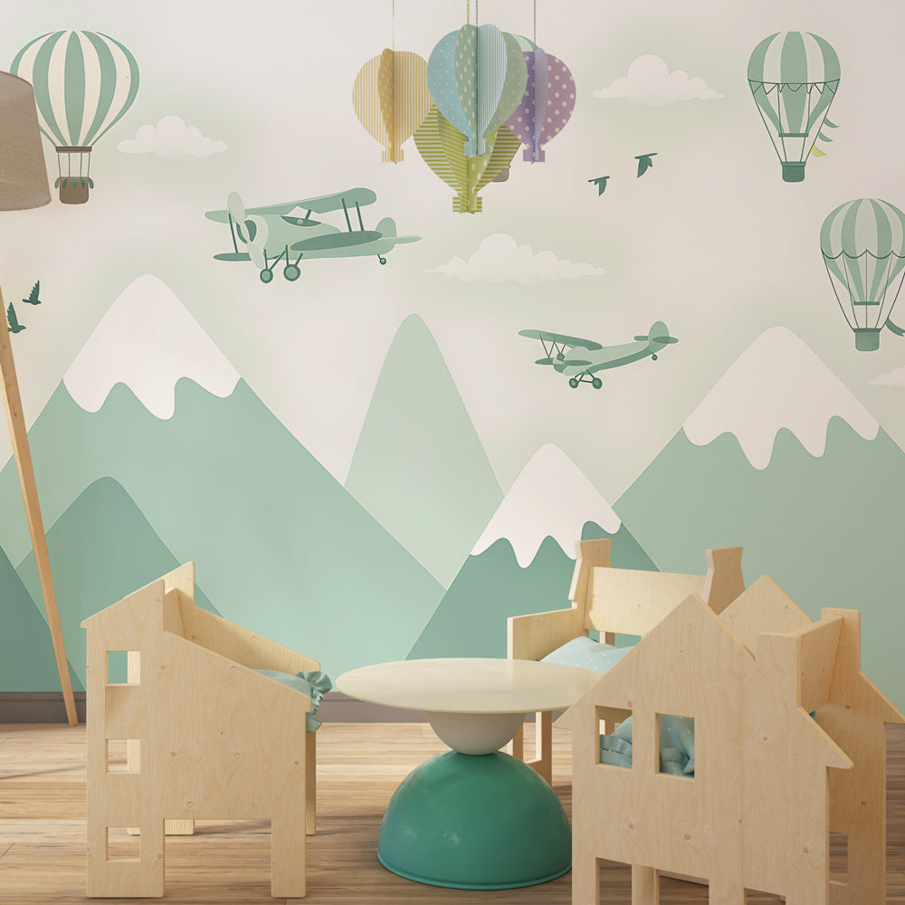 Adventure-themed wallpaper featuring mountains and planes in children's bedroom decor