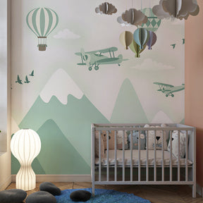 Hot air balloon and mountain wallpaper creating adventurous atmosphere in kids playroom