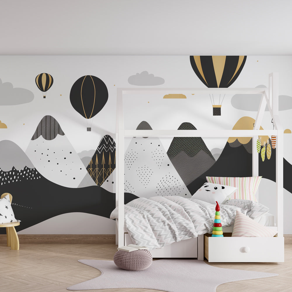 Monochrome adventure wallpaper featuring mountains and balloons in contemporary children's room