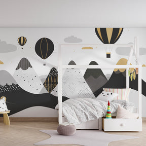 Monochrome adventure wallpaper featuring mountains and balloons in contemporary children's room