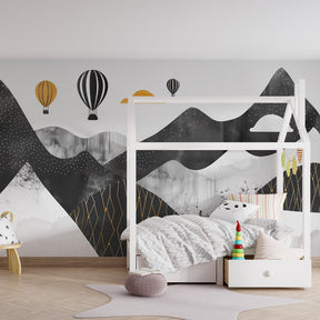 Modern geometric mountain wallpaper with colorful balloons inspiring adventure in kids playroom