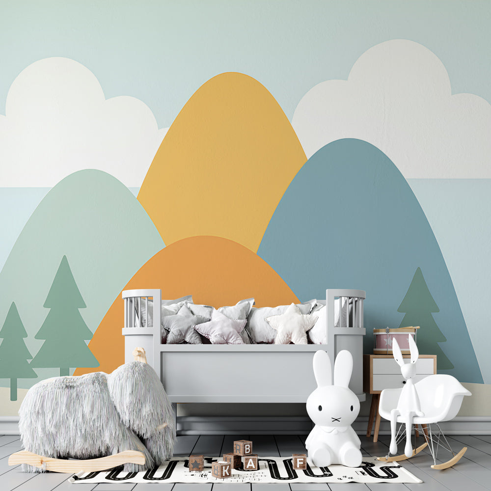 Serene mountain scene wallpaper creating calming atmosphere in kids bedroom with soft pastel colors