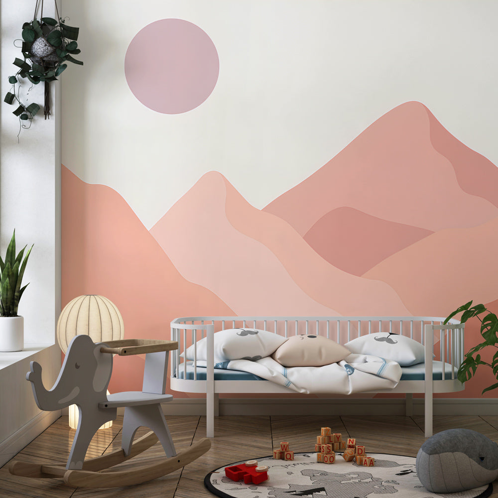 Soft pink mountain mural wallpaper transforming kids playroom into peaceful space