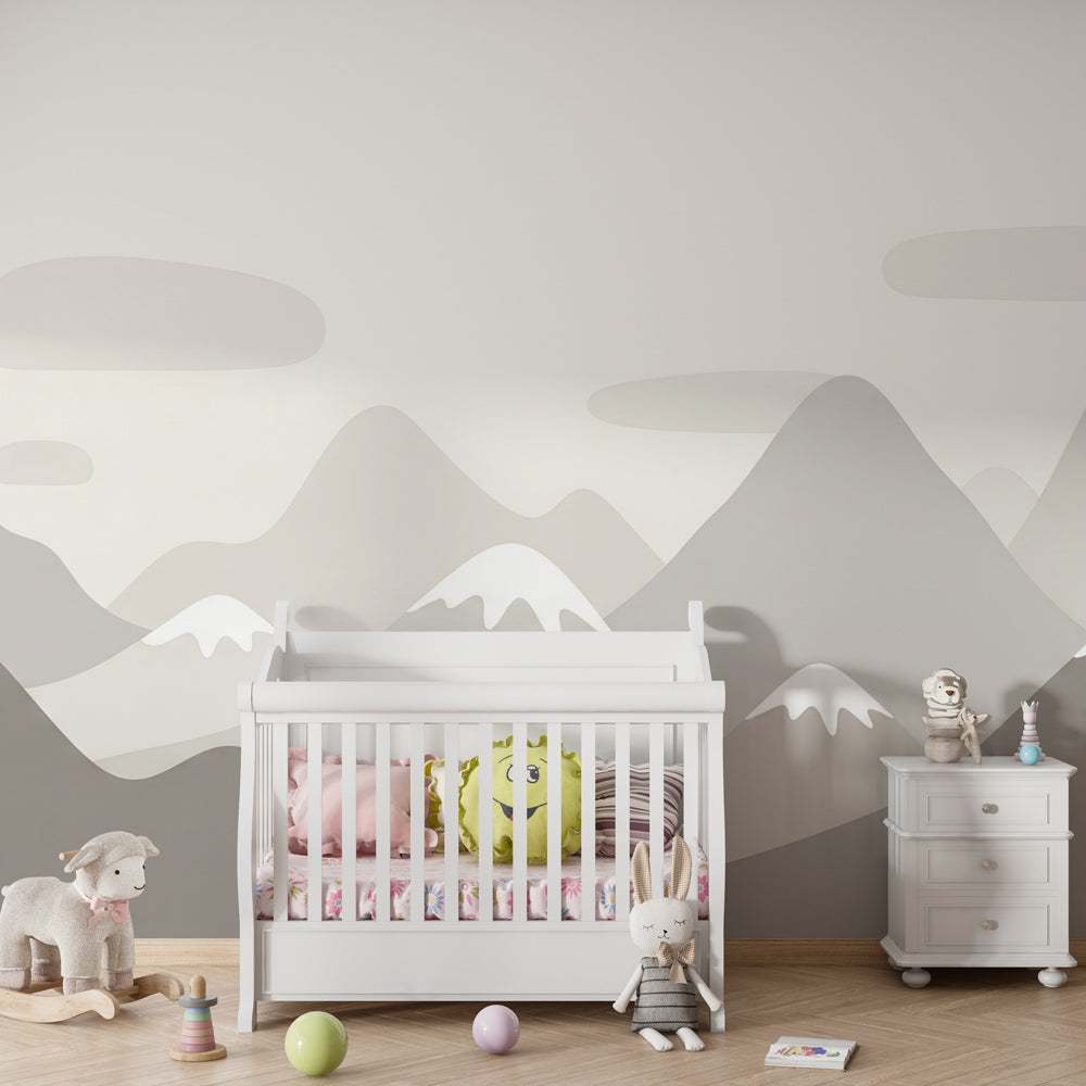 Mountain peaks wallpaper in kids bedroom with natural wood furniture and cozy atmosphere