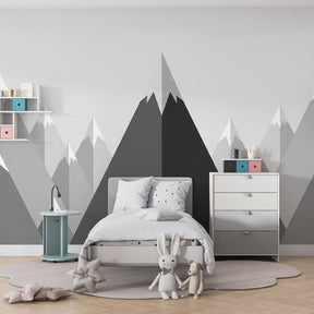 Monochrome mountain wallpaper creating serene children's bedroom decor with natural wood accents